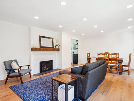 Full floor residential renovation transforming the main living space with updated finishes, flooring, and open-concept flow.