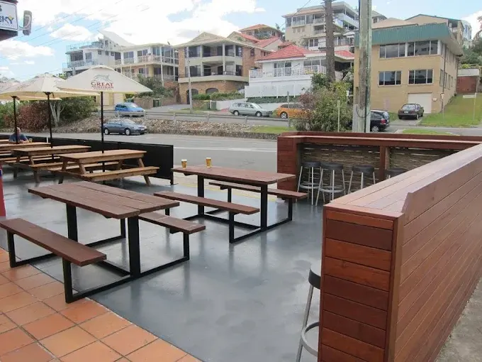 Grey finished concrete floor in an outdoor café dining area