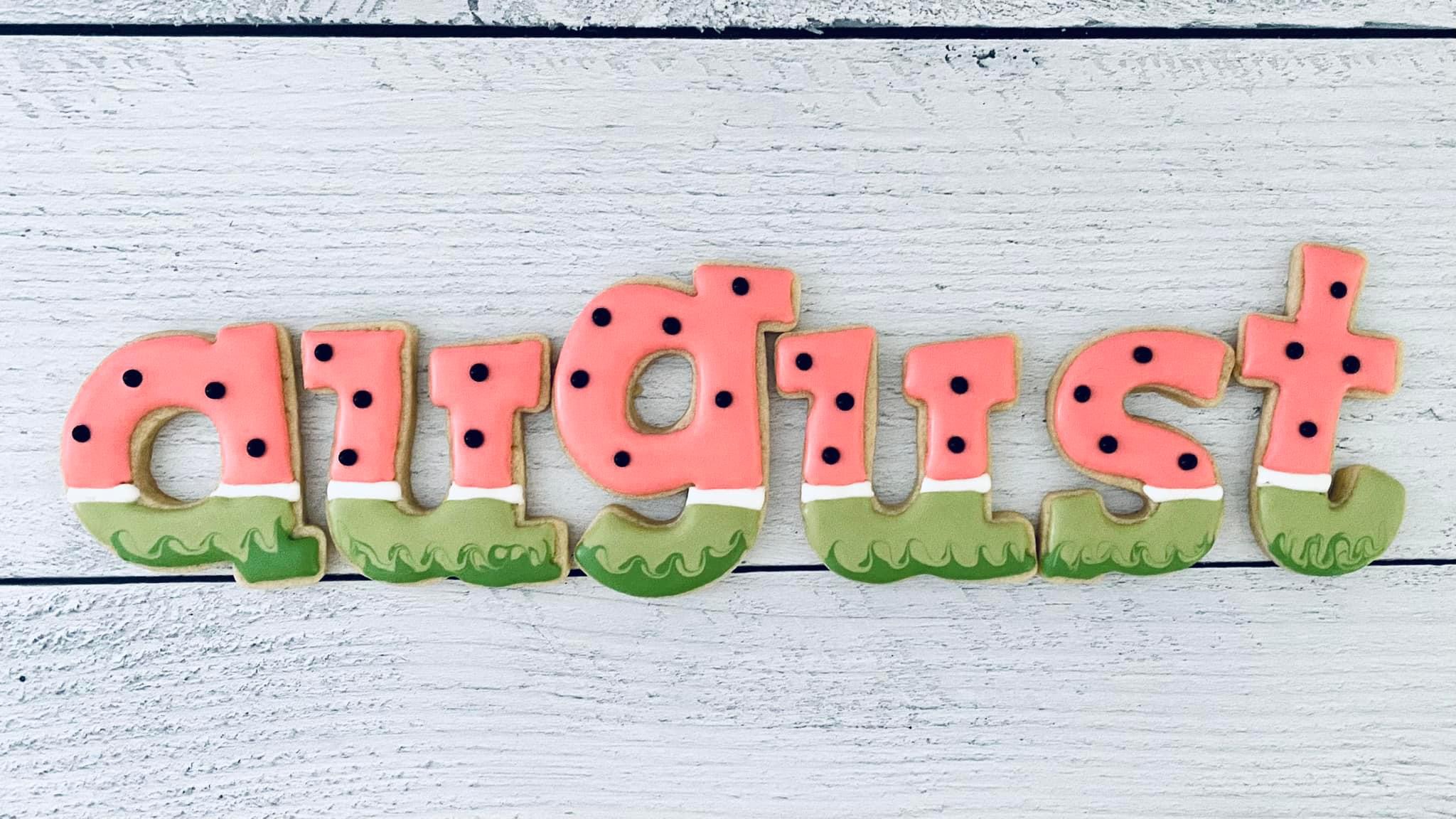 A beautiful arrangement of sugar cookies and royal icing decorating tools.