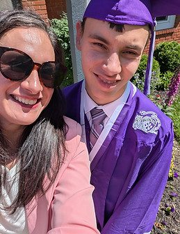 Brooke and her son at graduation in a cap and gown