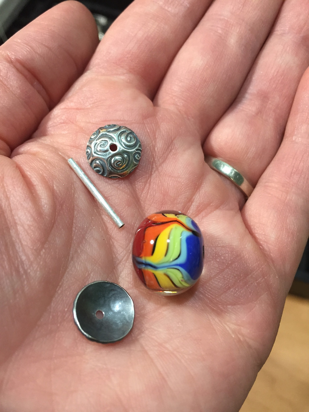making handmade lampwork glass earrings