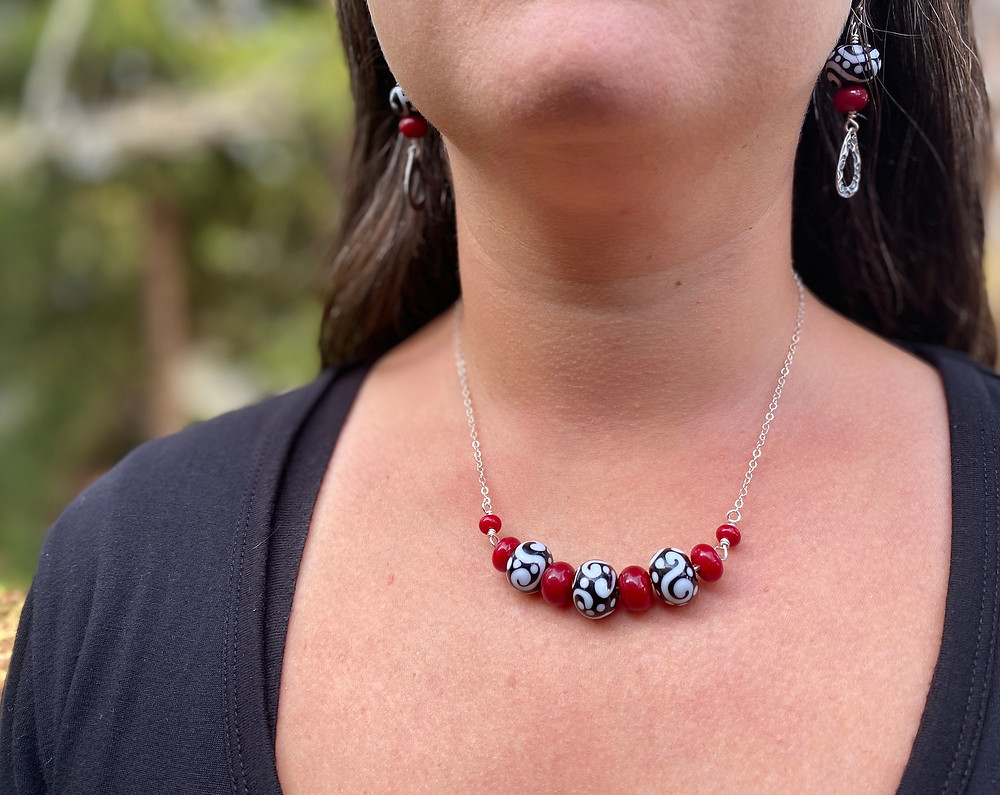 handmade necklace and earrings in black, white and red