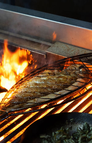 Grilled fish on a hot grill