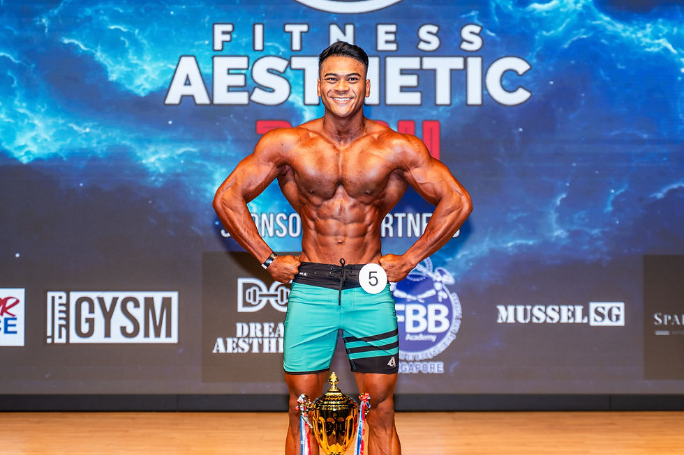 Past physique competitor on stage with trophy