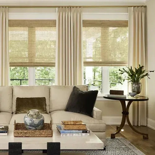 hunter douglas window treatments layering roller shades and curtains in living room