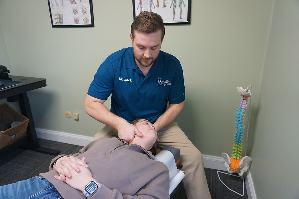 Dr. Jack Baccellieri providing chiropractic care to patient