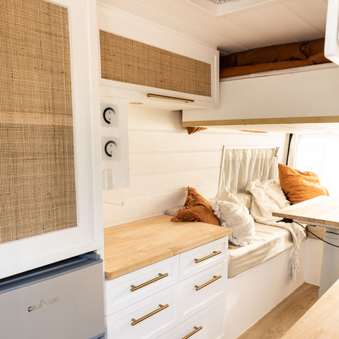 Bed Lift for Versatility: "The innovative bed lift feature in the Mercedes Sprinter camper van, offering versatility in space utilization."