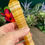 Thumbnail: hand holding Yellow Calcite Crystal Wand
