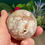 Thumbnail: hand holding a Pink Amethyst Sphere