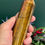 Thumbnail: hand holding Tigers eye tower