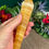 Thumbnail: hand holding Yellow Calcite Crystal Wand