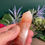 Thumbnail: Hand holding a Fire Quartz Point
