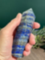 hand holding lapis lazuli tower