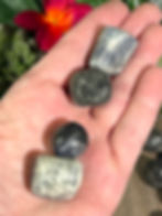 Iolite Tumbled Stone in palm of hand