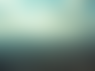 Vista aérea de uma grande cidade coberta por névoa, com muitos prédios densamente distribuídos e montanhas ao fundo sob um céu parcialmente nublado.