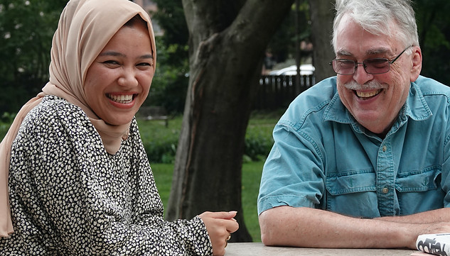 Fereshteh and Doug sit at a table and study