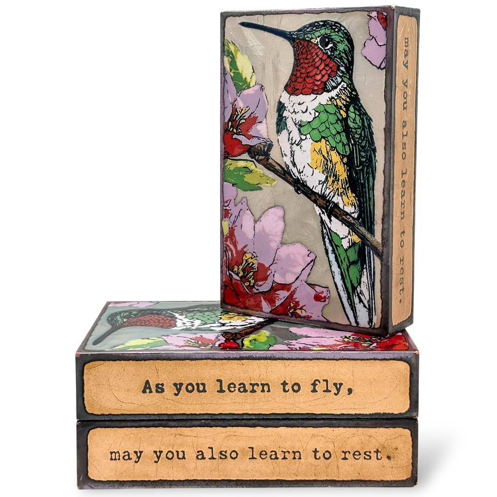 Thumbnail: Hummingbird artwork on a box reads "As you learn to fly, may you also learn to rest."