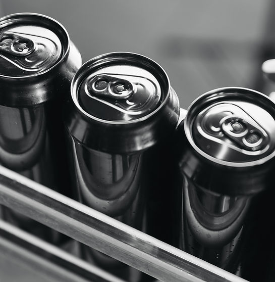 Black Steel beer cans in production line at modern brewery facility.jpg