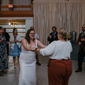 Two women dance together on the dance floor