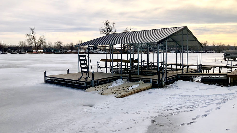 Boat dock and lift on the water in the winter.