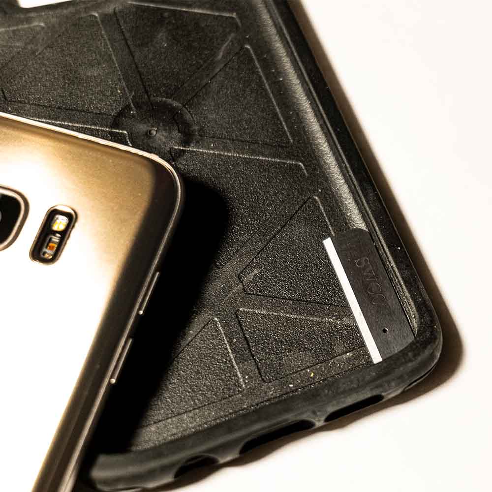 Picture of hiding a small implement in a phone case.