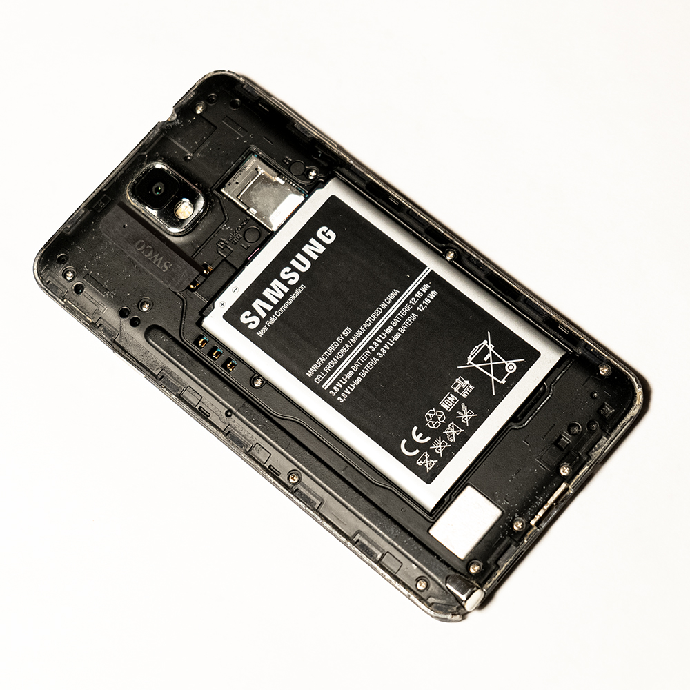 Cell phone showing how to conceal a small item.
