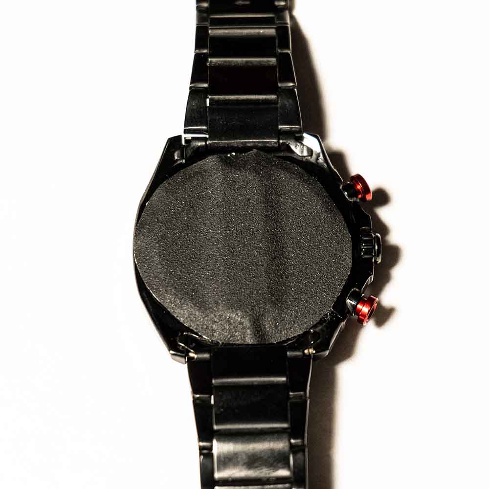 Watch with something taped to it.