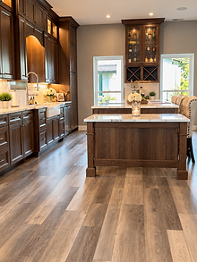 Serenity Grand kitchen with wood cabinetry, marble-look islands, and farmhouse sink