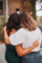 two friends hugging mental health support