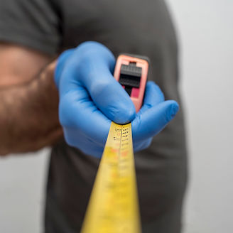 defocused-man-with-gloves-holding-tape-measurer-social-distancing.jpg