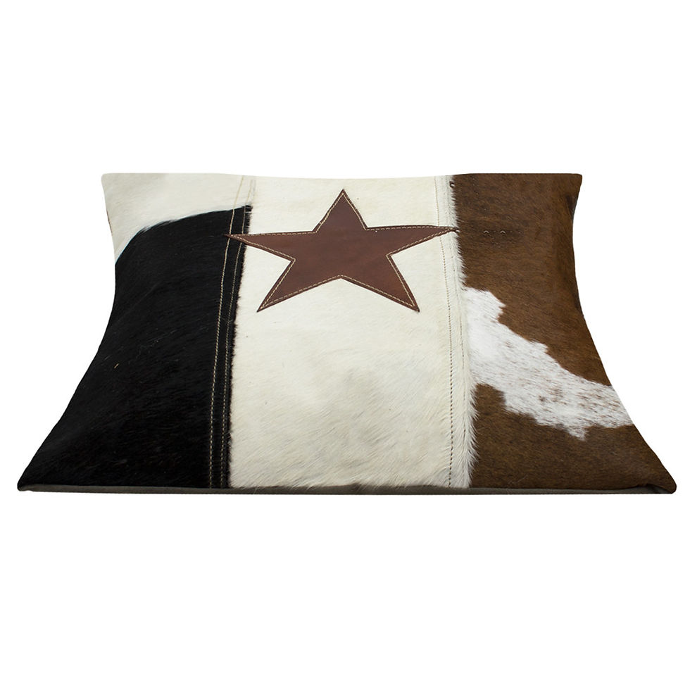 Thumbnail: Vintage cow hide and star cushion. Black, white, tan colours featuring centred star in tan. Natural reverse.