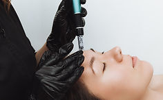 Cosmetic mesotherapy for facial rejuvenation. Cosmetic procedure of microneedling. The cos