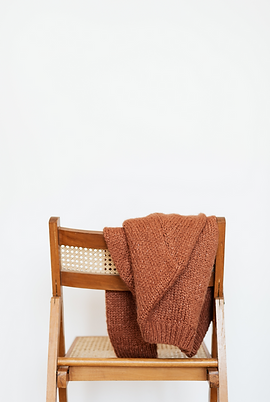 sweater folded on a chair