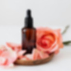 Beard oil bottle in front of a bar of soap