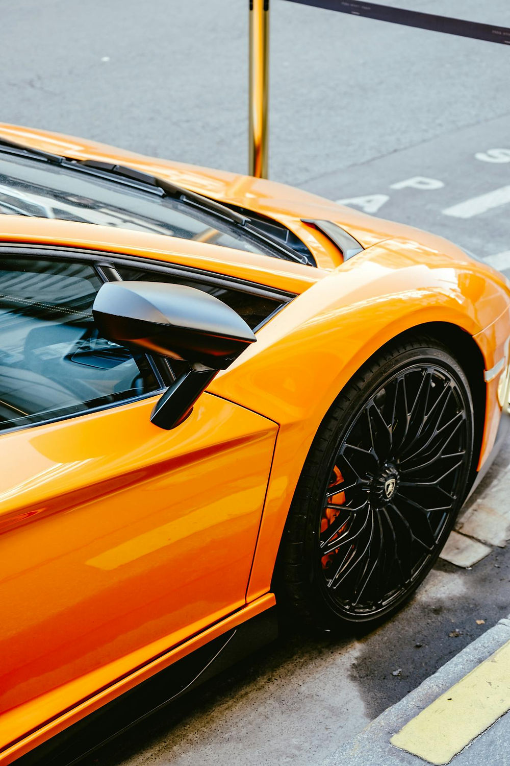 Side view of an orange Lamborghini sports car