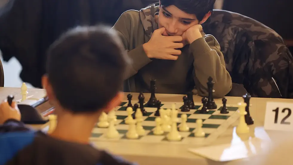 Picture. of teenagers playing chess, a new obsession