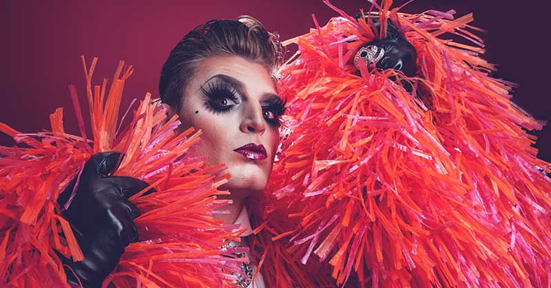 Reuben Kaye with feather boa