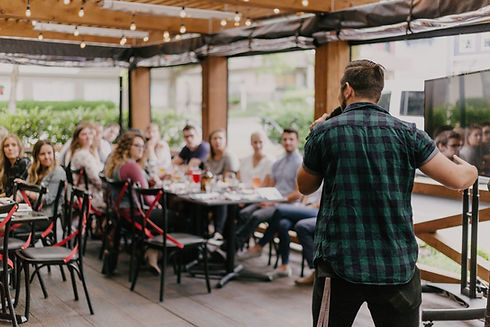 man standing infront of group of people_edited_edited.jpg