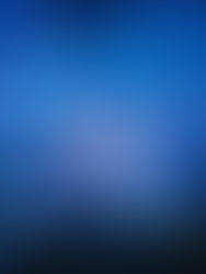 Concert crowd with hands raised under blue laser lights and smoke, creating an energetic atmosphere. Bright stage with red and blue visuals.