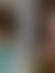 Split portrait of a man in teal light and a smiling woman on a train, both looking off-camera.