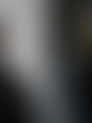 Two men in a split image. Left: man in a black jacket, neutral expression. Right: bald man wearing bright green sunglasses, intense gaze.