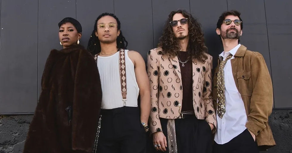 Four stylish adults pose against a dark wall, wearing sunglasses and patterned outfits, with serious expressions.