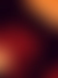 Tattooed person adjusting their hood in a moody, warm orange light. They appear thoughtful, with shadows enhancing the dramatic setting.