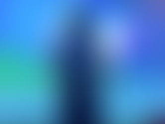 Animated character with black hair wearing a blue outfit stands in front of an aurora-lit sky. The setting feels mystical and calm.