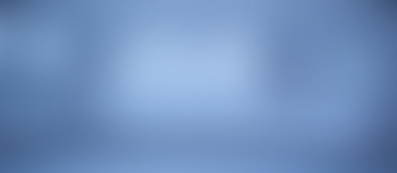 Two men sit in the back seat of a car, seen through a foggy blue rear window, facing each other in a quiet mood.