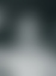 Man in sunglasses and a white shirt throws a rock sign in a dimly lit club. "TERRY" visible on wall. Smiling, energetic vibe.