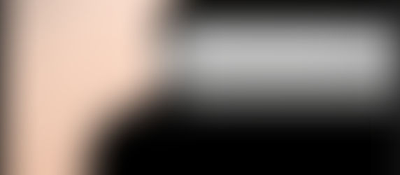 Man with headphones, left half of face clear, right half distorted into horizontal lines. Background is a soft peach color. Abstract and surreal.