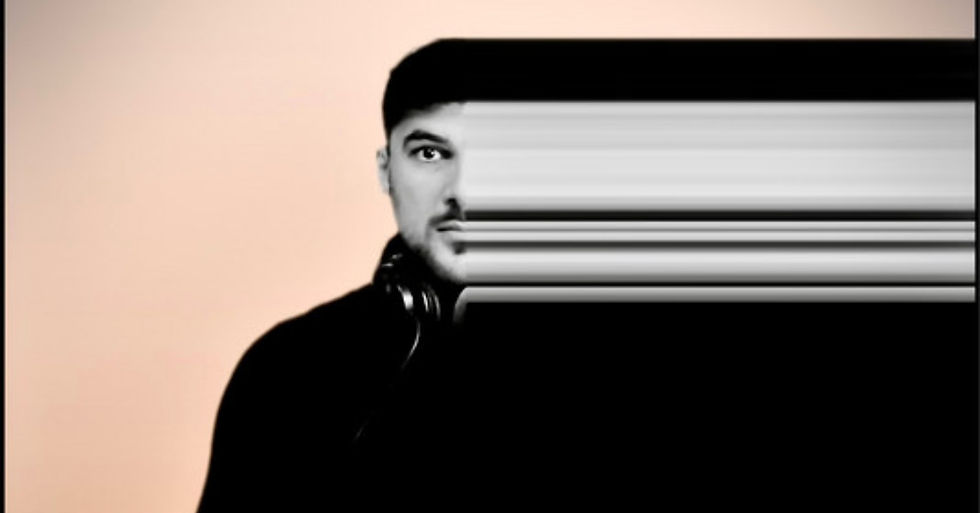 Man with headphones, left half of face clear, right half distorted into horizontal lines. Background is a soft peach color. Abstract and surreal.