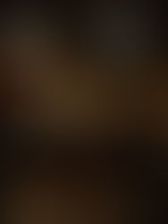 Crowd lined up outside a venue with "Quarters" on the facade. Illuminated by streetlights, the scene has a lively night-time vibe.