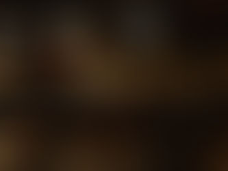 Crowd lined up outside a venue with "Quarters" on the facade. Illuminated by streetlights, the scene has a lively night-time vibe.